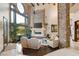 Grand living room featuring a stone fireplace, high ceilings, and large windows with a view at 5764 Aspen Falls Cir, Las Vegas, NV 89149