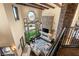 Elevated view of the open living space with a stone fireplace and two-story windows at 5764 Aspen Falls Cir, Las Vegas, NV 89149