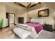 Spacious main bedroom showcases tray ceilings, plush carpets, and stylish decor at 5764 Aspen Falls Cir, Las Vegas, NV 89149