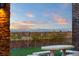 Outdoor stone patio with a view of city, perfect for outdoor dining at 5764 Aspen Falls Cir, Las Vegas, NV 89149