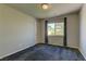 Carpeted bedroom with a ceiling fan and a window with curtains at 6074 Gordon Creek Ave, Las Vegas, NV 89139