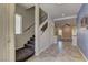 Welcoming entryway with tile flooring, stairs to upper level, and sightlines into living areas at 6074 Gordon Creek Ave, Las Vegas, NV 89139