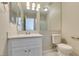 Well-lit bathroom with a large mirror, white vanity, and shower-tub combination at 6250 W Flamingo Rd # 43, Las Vegas, NV 89103