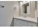 Bright bathroom featuring a white vanity with a stylish round sink and chrome fixtures at 6250 W Flamingo Rd # 43, Las Vegas, NV 89103
