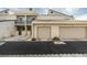 Exterior view of condo building featuring two garage spaces and assigned parking at 6250 W Flamingo Rd # 43, Las Vegas, NV 89103
