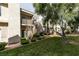Charming condo building with landscaped yard and mature trees creating a beautiful residential scene at 6250 W Flamingo Rd # 43, Las Vegas, NV 89103
