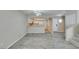 Stylish living room showcasing the kitchen, wood-look floors, and access to the staircase at 6250 W Flamingo Rd # 43, Las Vegas, NV 89103
