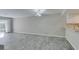 Open-concept living room with tiled floors, modern lighting, and a breakfast bar at 6250 W Flamingo Rd # 43, Las Vegas, NV 89103
