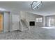 Inviting living room featuring a fireplace, tiled floors, and an open staircase at 6250 W Flamingo Rd # 43, Las Vegas, NV 89103