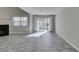 Living room featuring a fireplace, tiled floors, and sliding glass doors at 6250 W Flamingo Rd # 43, Las Vegas, NV 89103