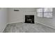 Living room showcasing a fireplace, tiled floor, and natural light from the window at 6250 W Flamingo Rd # 43, Las Vegas, NV 89103