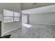 Bright living room featuring wood-look tile floors, and large windows with natural light at 6250 W Flamingo Rd # 43, Las Vegas, NV 89103