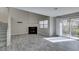 Living room with a fireplace, tiled floors, sliding glass doors, and open staircase at 6250 W Flamingo Rd # 43, Las Vegas, NV 89103