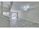 Spacious living room with tiled floors, modern light fixture, and a sliding glass door at 6250 W Flamingo Rd # 43, Las Vegas, NV 89103