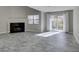 Cozy living room with a fireplace, tiled floors, and natural light from a sliding glass door at 6250 W Flamingo Rd # 43, Las Vegas, NV 89103