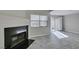 Living room with tiled floors, a fireplace, and a sliding glass door to the outside at 6250 W Flamingo Rd # 43, Las Vegas, NV 89103