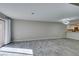 Spacious living area features tile flooring, neutral walls, and sliding glass door at 6250 W Flamingo Rd # 43, Las Vegas, NV 89103