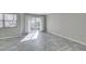 Bright living room featuring tile flooring, a sliding glass door, and neutral walls at 6250 W Flamingo Rd # 43, Las Vegas, NV 89103