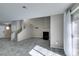 Open-concept living room with tile flooring, a fireplace, and sliding glass door at 6250 W Flamingo Rd # 43, Las Vegas, NV 89103