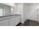 Bathroom features a double sink vanity, large mirror, and walk-in shower at 6269 Blood Lily Ave, Las Vegas, NV 89122