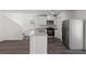 Modern kitchen featuring stainless steel appliances, an island with sink, and ample cabinet space at 6269 Blood Lily Ave, Las Vegas, NV 89122