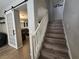 Staircase with wood treads, white risers, and access to the main living area at 6567 Fieldmouse Ave, Las Vegas, NV 89142