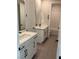 Bright bathroom featuring dual sinks, tile flooring, and modern fixtures at 7142 Twilight Rider Ct, Las Vegas, NV 89118