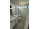 Bathroom featuring a marble tiled shower and a granite countertop at 7142 Twilight Rider Ct, Las Vegas, NV 89118