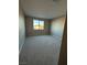 Bedroom featuring a double-hung window and neutral carpet at 7142 Twilight Rider Ct, Las Vegas, NV 89118