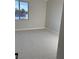 Cozy bedroom featuring neutral walls, carpeted floor, and natural light at 7142 Twilight Rider Ct, Las Vegas, NV 89118