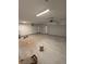 Spacious garage with overhead lights and three garage doors at 7142 Twilight Rider Ct, Las Vegas, NV 89118