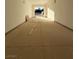 Spacious garage with a roll-up door and concrete flooring at 7142 Twilight Rider Ct, Las Vegas, NV 89118