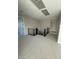 Hallway featuring modern metal stair railing and neutral carpet at 7142 Twilight Rider Ct, Las Vegas, NV 89118