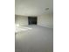 Spacious living room with neutral carpet and bright natural light at 7142 Twilight Rider Ct, Las Vegas, NV 89118