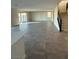 Open-concept living room with tile flooring and access to the backyard at 7142 Twilight Rider Ct, Las Vegas, NV 89118