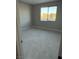 Bedroom interior with neutral walls and a window overlooking the neighborhood at 7199 Twilight Rider Ct, Las Vegas, NV 89118