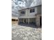 Two-story home with gray stone accents and a three-car garage, showing modern architecture at 7199 Twilight Rider Ct, Las Vegas, NV 89118