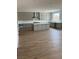 Kitchen featuring light grey cabinets, stainless steel appliances, and an island with a white countertop at 7199 Twilight Rider Ct, Las Vegas, NV 89118