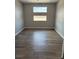 Office space featuring hard surface flooring and two windows, in a neutral color palette at 7199 Twilight Rider Ct, Las Vegas, NV 89118