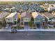 An aerial view of a residential neighborhood with modern homes and well-maintained streets at 7629 Rosebark Cliffs St, North Las Vegas, NV 89084
