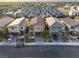 An aerial view of a residential neighborhood with modern homes and well-maintained streets at 7629 Rosebark Cliffs St, North Las Vegas, NV 89084