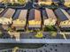 An aerial view of a fenced backyard with a covered patio area at 7629 Rosebark Cliffs St, North Las Vegas, NV 89084