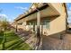 A covered patio with a brick floor and a view of the backyard at 7629 Rosebark Cliffs St, North Las Vegas, NV 89084