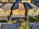 An aerial view of a fenced backyard with a covered patio area at 7629 Rosebark Cliffs St, North Las Vegas, NV 89084