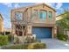 Inviting two-story home showcasing a charming facade with desert landscaping and a two-car garage at 7629 Rosebark Cliffs St, North Las Vegas, NV 89084