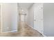Neutral hallway with tile flooring, white doors, and recessed lighting at 7629 Rosebark Cliffs St, North Las Vegas, NV 89084
