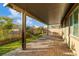A covered patio with a brick floor and a view of the backyard at 7629 Rosebark Cliffs St, North Las Vegas, NV 89084