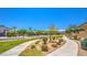 Landscaped community park featuring walking paths, benches, and lush greenery at 7856 Stone Forest St, North Las Vegas, NV 89084