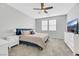 Comfortable bedroom featuring a ceiling fan, neutral walls, carpet, and a bright window at 787 Cottonwood Hill Pl, Henderson, NV 89011