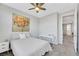 Inviting bedroom featuring carpeted floors, a comfortable bed, and a light color scheme at 787 Cottonwood Hill Pl, Henderson, NV 89011